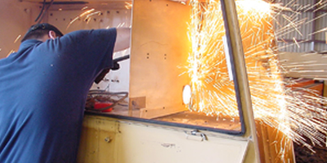 Photo of man plasma cutting